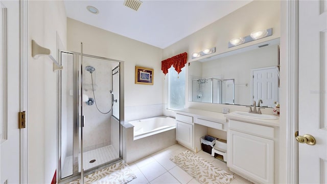 bathroom with tile patterned flooring, vanity, and plus walk in shower