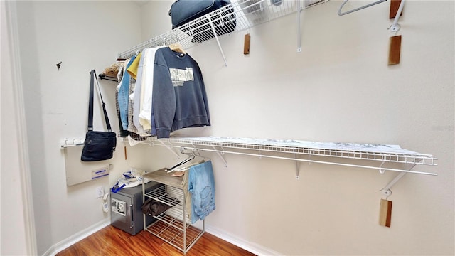 walk in closet featuring hardwood / wood-style flooring