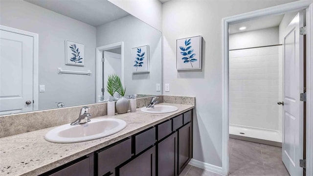 bathroom with vanity, tile patterned floors, and walk in shower