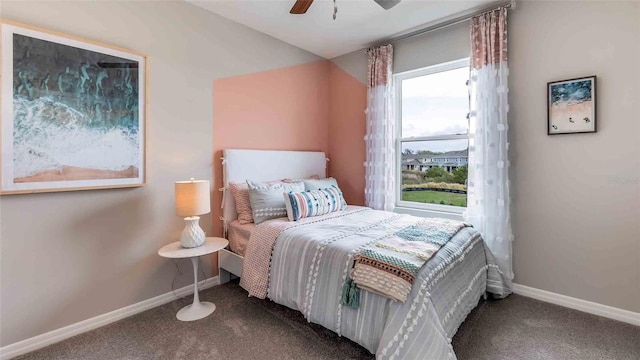 bedroom with ceiling fan and carpet floors