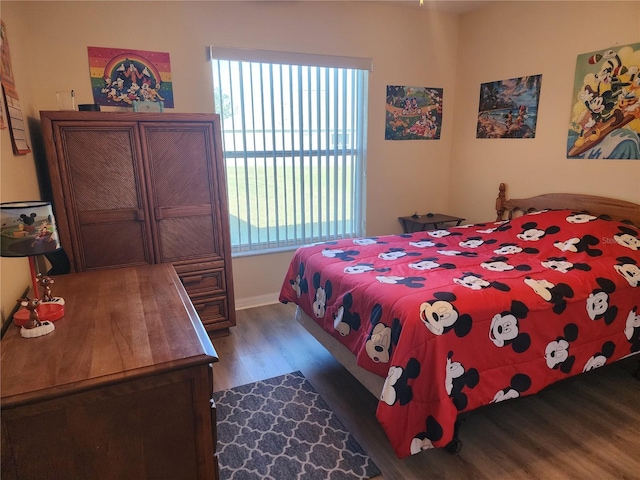 bedroom featuring dark wood-type flooring