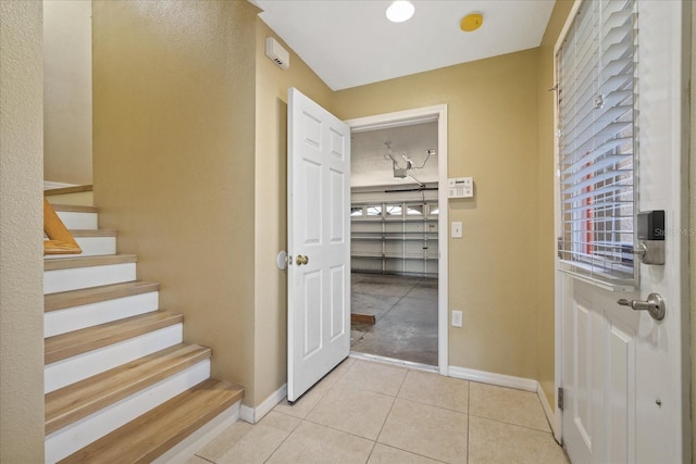 interior space featuring plenty of natural light and light tile patterned floors