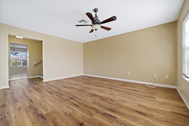 unfurnished room featuring ceiling fan and light hardwood / wood-style floors