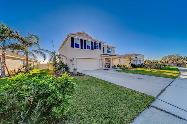 view of front of home featuring a garage and a front yard