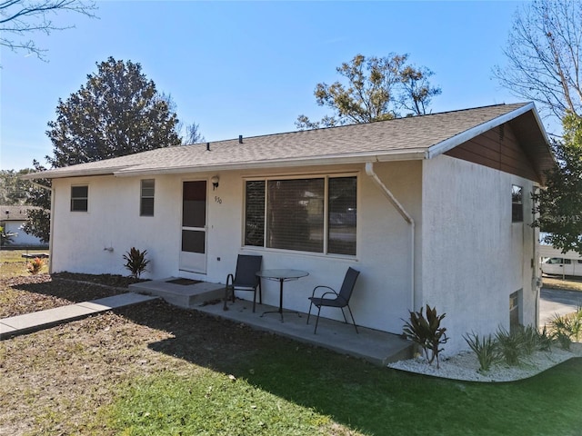 rear view of property featuring a patio area