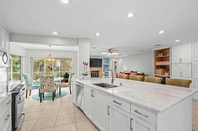 kitchen featuring white cabinetry, sink, and stainless steel appliances