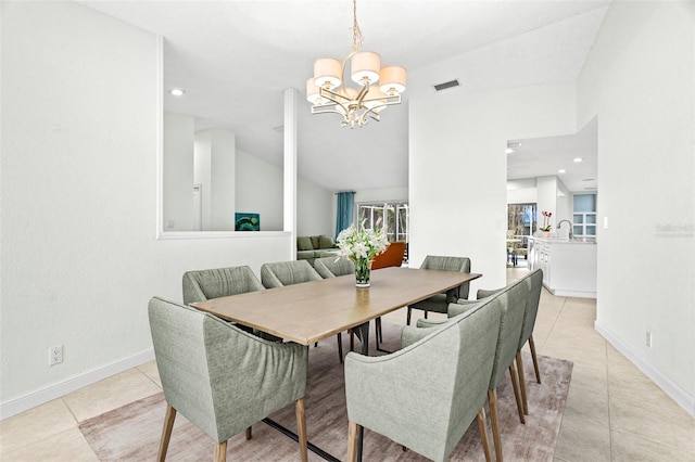 dining room featuring light tile patterned floors and a notable chandelier