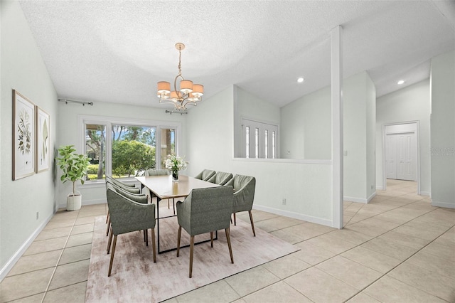 tiled dining room with a textured ceiling, vaulted ceiling, and a notable chandelier