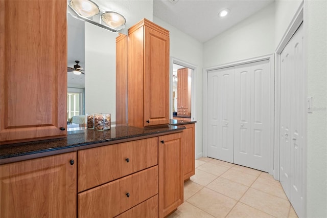 interior space featuring tile patterned floors and ceiling fan