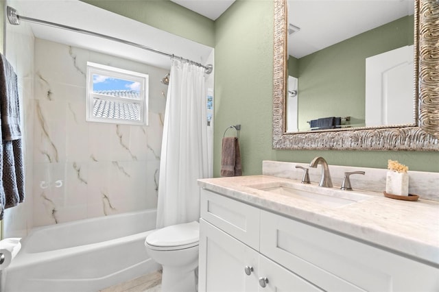 full bathroom featuring shower / tub combo with curtain, vanity, and toilet