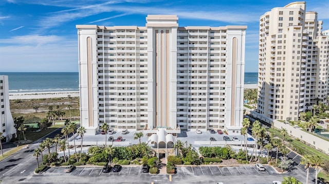 view of property featuring a water view and a view of the beach