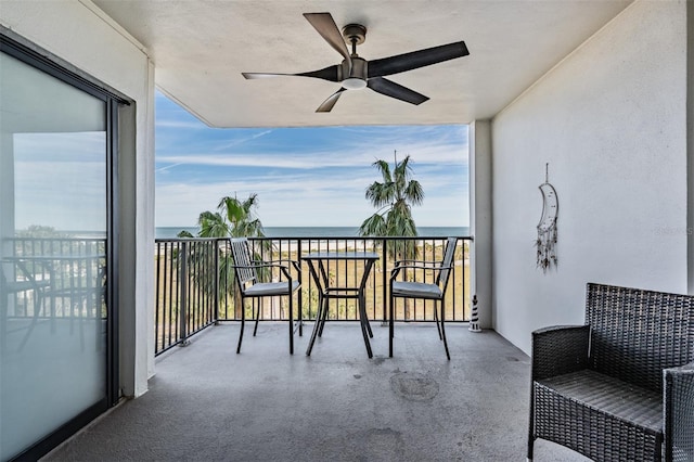 balcony featuring a water view