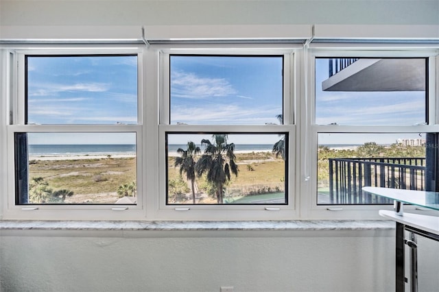 room details with a water view and a view of the beach