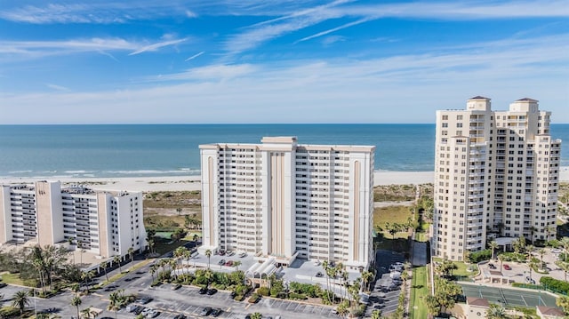 bird's eye view with a water view and a view of the beach