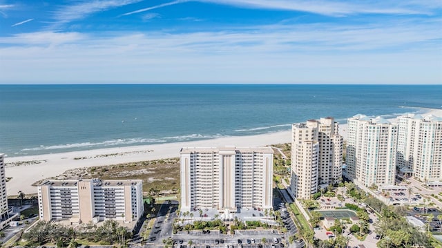 birds eye view of property with a view of the beach and a water view