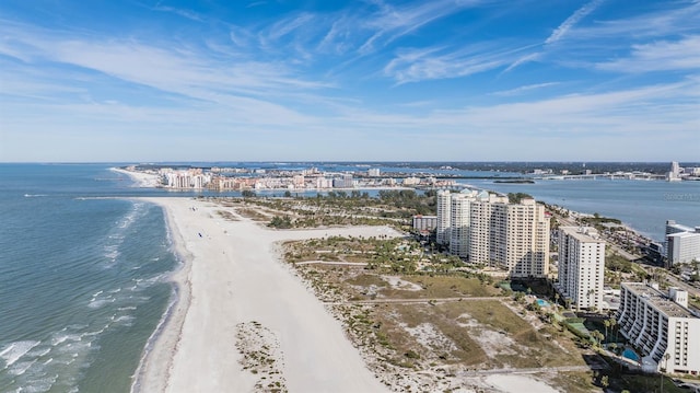 bird's eye view with a water view and a beach view