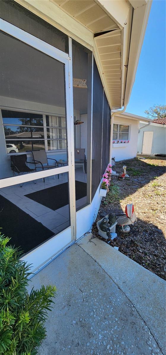 view of patio featuring a sunroom