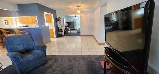 tiled living room with ceiling fan