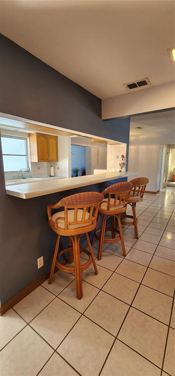 dining space with light tile patterned floors