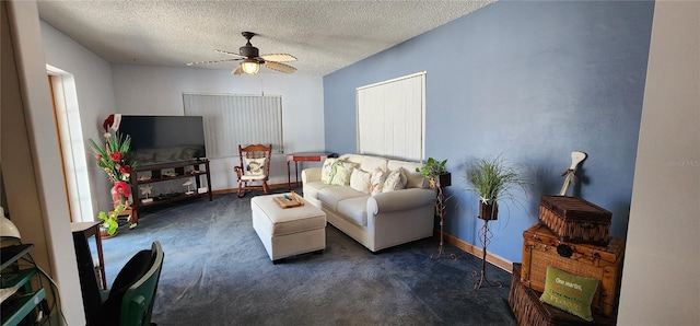 living room with dark colored carpet, a textured ceiling, and ceiling fan