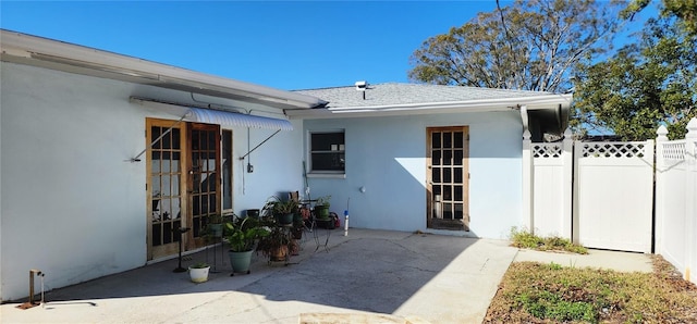 property entrance with a patio