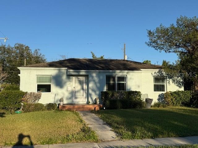 view of front of home with a front lawn