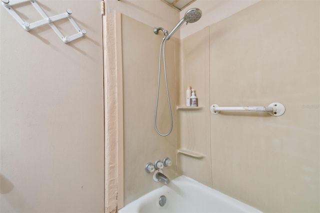 bathroom with washtub / shower combination