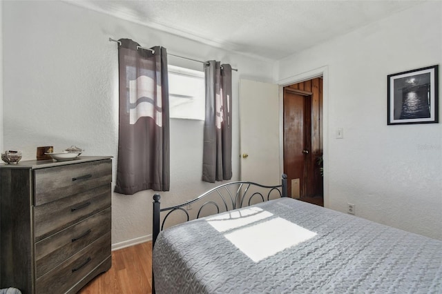 bedroom with light wood-type flooring