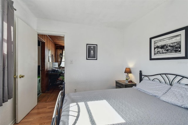 bedroom with wood-type flooring