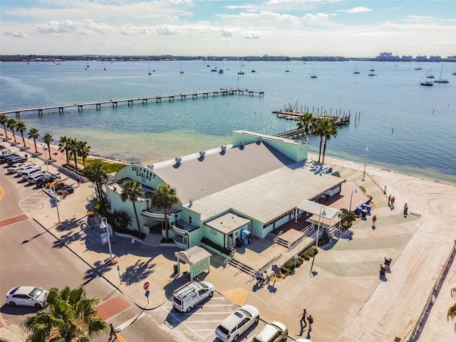 drone / aerial view featuring a water view and a view of the beach