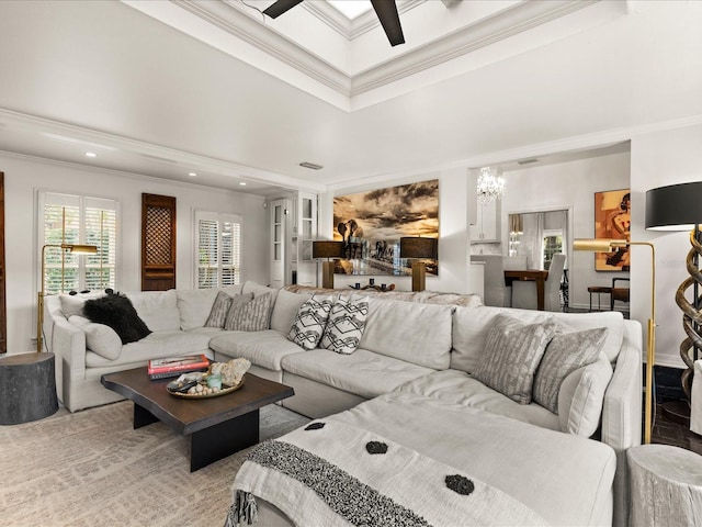 living room featuring ceiling fan and ornamental molding