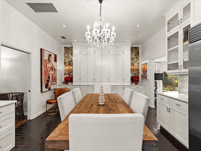 dining space featuring an inviting chandelier