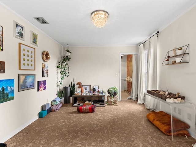 recreation room featuring a notable chandelier and ornamental molding