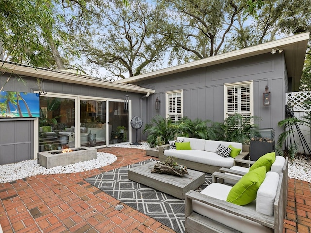 view of patio / terrace featuring an outdoor living space with a fire pit