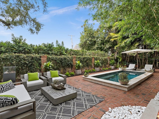 view of swimming pool with a patio area and an outdoor living space