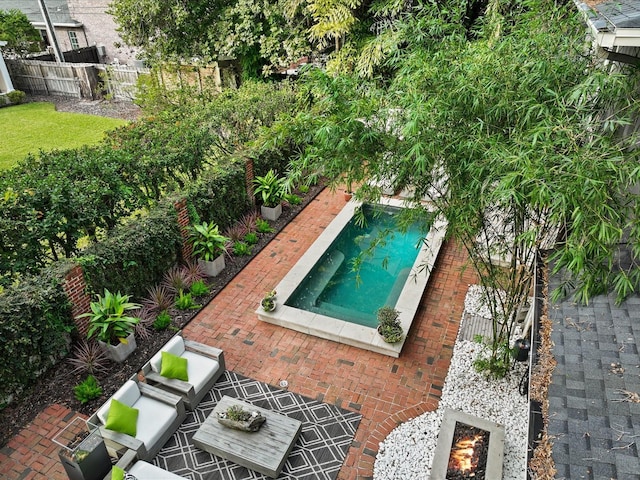 view of swimming pool with outdoor lounge area and a patio