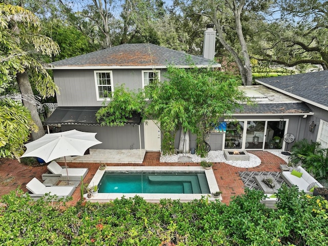 rear view of house featuring a patio