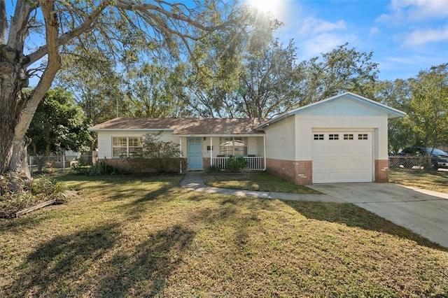 ranch-style house with a garage, covered porch, and a front lawn