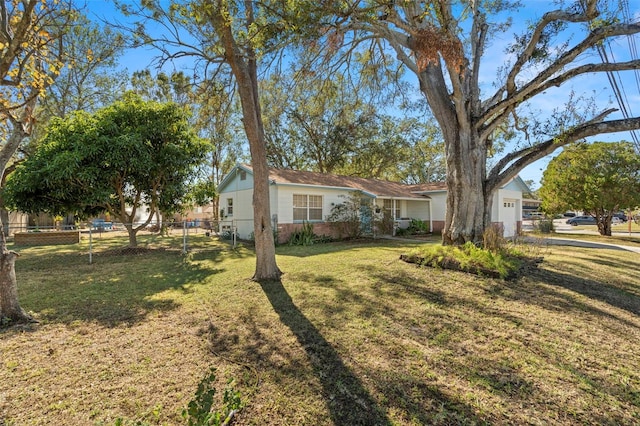 ranch-style house with a front lawn