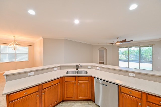 kitchen with stainless steel dishwasher, light tile patterned floors, crown molding, ceiling fan with notable chandelier, and sink