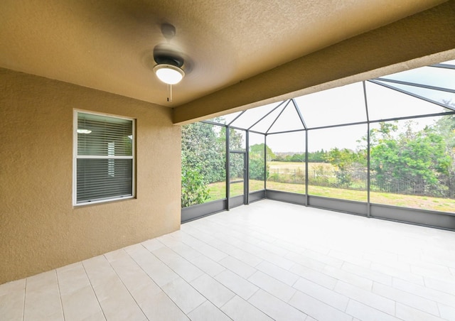 view of patio with a lanai