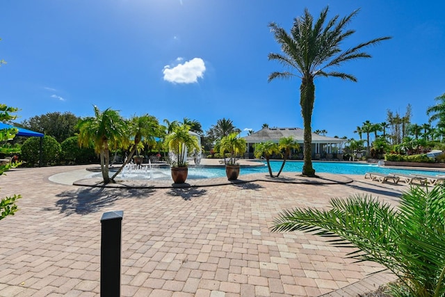 view of swimming pool featuring pool water feature