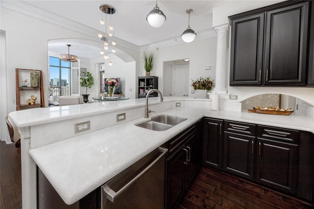 kitchen with sink, pendant lighting, stainless steel dishwasher, and kitchen peninsula