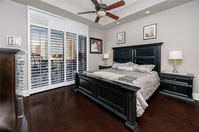 bedroom featuring dark wood-type flooring, ceiling fan, and access to outside