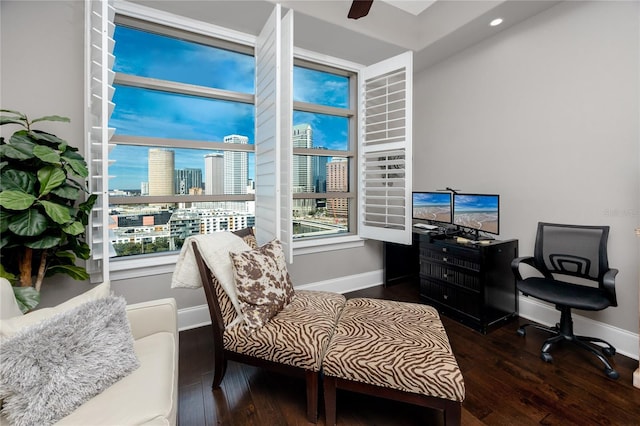 office area with ceiling fan and dark hardwood / wood-style floors