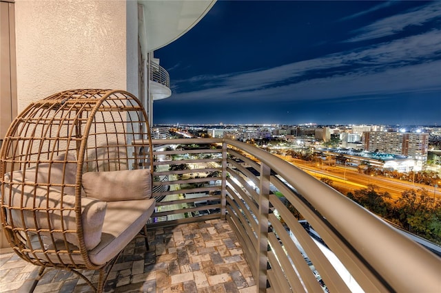 view of balcony at twilight