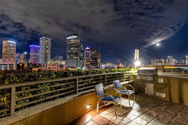 balcony at night with a grill