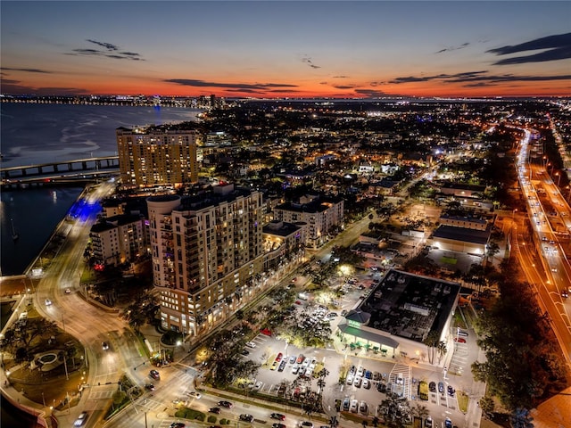 aerial view at dusk with a water view