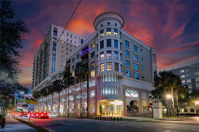 view of outdoor building at dusk