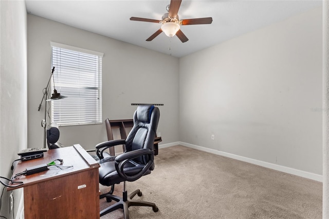 carpeted home office with ceiling fan